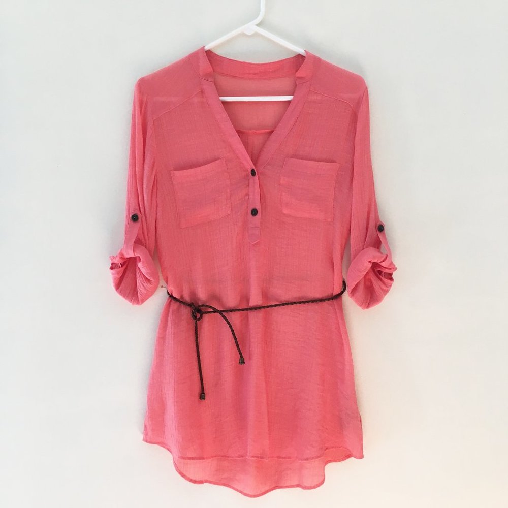 Coral V-neck 3/4 sleeve blouse with leather belt.